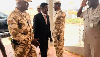Somalia's Internal Security Minister is received at Ouagadougou airport by Burkina Faso security officials ahead of counterterrorism talks.