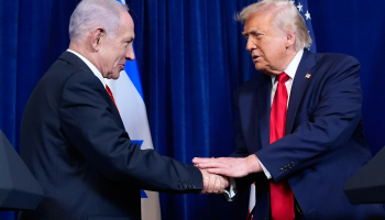 US President Donald Trump, right, shakes hands with Prime Minister Benjamin Netanyahu during a news conference at Mar-a-Lago, on December 29, 2025, in Palm Beach, Florida. (AP Photo/Alex Brandon)