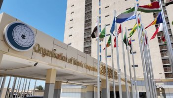 Flags of member states displayed outside the headquarters of the Organisation of Islamic Cooperation (OIC) in Jeddah, Saudi Arabia.